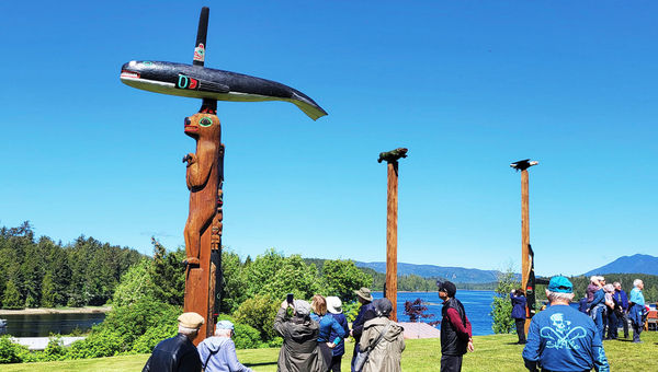 Cruise guests visit a totem park near the Klawock Island port.