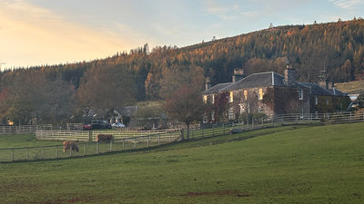 The sun sets over The Old Manse of Blair, a boutique hotel in the Scottish Highlands.