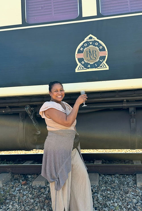 The author in front of a Rovos Rail Luxury Train car in Hwange National Park, Zimbabwe. The author in front of a Rovos Rail Luxury Train car in Hwange National Park, Zimbabwe.