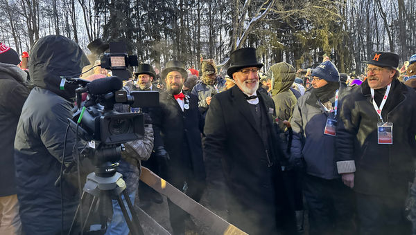 Tom Dunkel, president of the Groundhog Club’s Inner Circle, arrives in Gobbler's Knob on his way to knock on Punxsutawney Phil’s burrow, where he received the news that winter will last another six weeks.