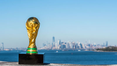 The World Cup trophy with New York in the background. The U.S., Canada and Mexico will host the 2026 tournament.